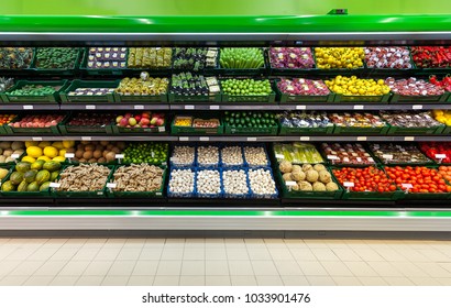 Fresh fruits and vegetables on the shelf in the supermarket  