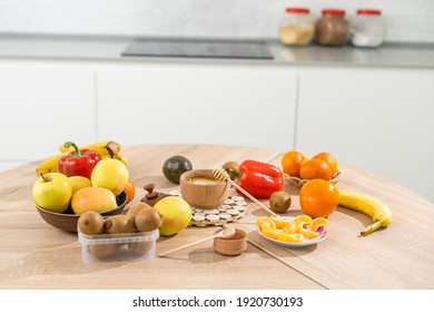 fresh fruits and vegetables on the table in kitchen interior, healthy food concept