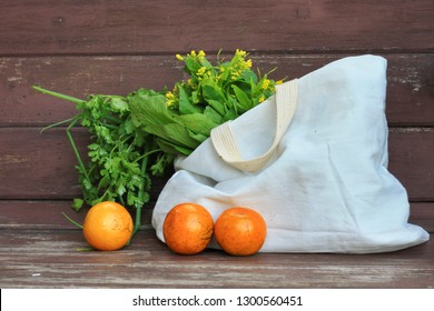 Fresh Fruits And Vegetables In A Tote Bag On A  Wooden Table Background.Use Tote Bag For Replacement Plastic Bag Can Save The Earth.Zero Waste, Healthy Eating, Package Free,Green Living Concept.