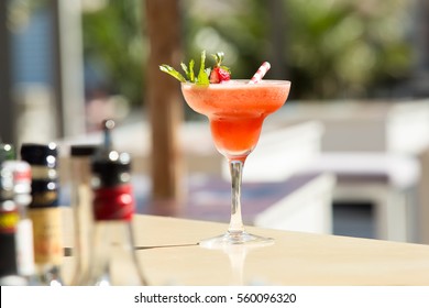 FRESH FRUITY ALCOHOLIC DRINK, LIQUEUR WITH STRAW, STRAWBERRY, CHERRY AND MINT