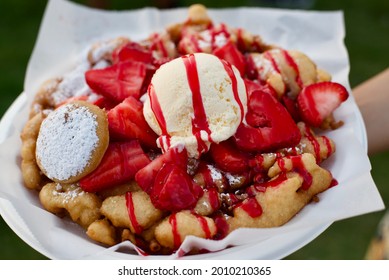 Fresh Funnel Cake With Strawberries And Ice Cream And A Deep Fried Oreo.