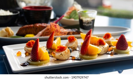 fresh fusion food. colorful dishes of giant scallops with strawberry and sunquick orange. Asian fusion food - Shutterstock ID 1907929747
