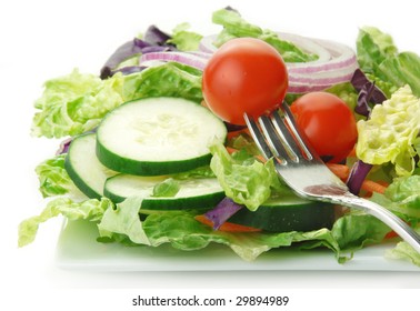 Fresh Garden Salad With Lettuce Onion Tomato Cucumber On White Background.