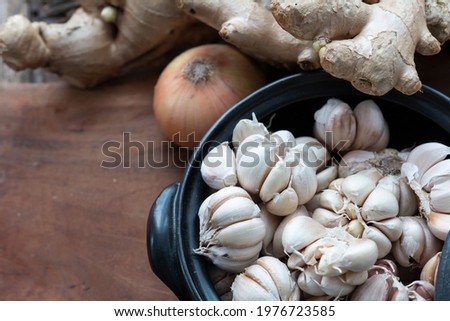Fresh garlic in bowl, ginger and Vegetable in bowl for making kimchi. Mixed raw vegetables in traditional bowl used for cooking and making preserved food.