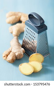 Fresh Ginger And Grater Over Blue