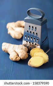 Fresh Ginger And Grater Over Blue 