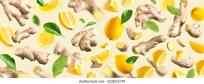 Fresh ginger root, Juicy ripe yellow lemons, green leaves flying on beige background. Creative food concept. Natural organic ginger for health, medicine. Fruit citrus, vitamin C. Lemon slices. Pattern - Powered by Shutterstock