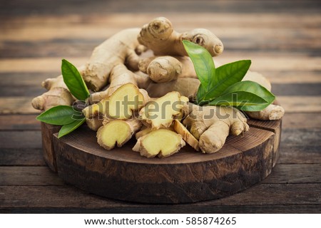 Fresh ginger root on the wooden table