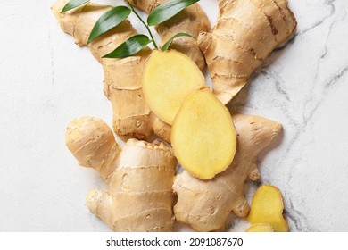 Fresh Ginger And Slices On Light Background