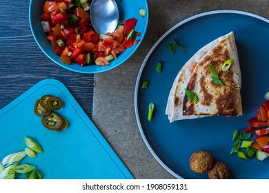 Fresh Gluten Free Tortilla Wrap Stuffed With Chickpea Falafel, Fresh Vegetables Chopped Salad, Fried Onion Rings, Jalapenos, Mayo And Scallions. Healthy And Tasty Meal Preparation. Top View.