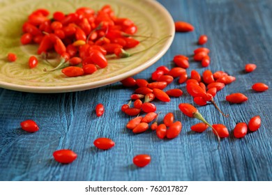 Fresh Goji Berries On Table And Plate