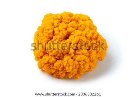 fresh golden ear mushroom or tremella mesenterica (yellow brain fungus) isolated on white background.
