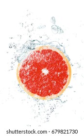 fresh grapefruit falling in water