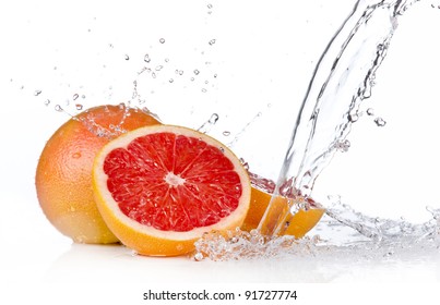 Fresh grapefruits in water splash, isolated on white background