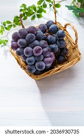 Fresh Grapes On Wooden Table