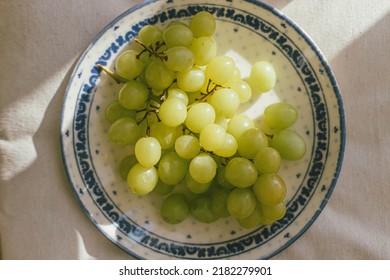 Fresh Grapes In Sunlight On Ceramic Plate Flat Lay. Healthy Food Aesthetics. Summer Fruits In Light On Soft Linen Background. Summertime In Countryside, Moody Banner