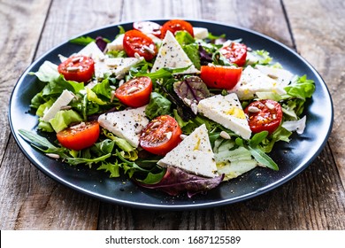 Fresh greek salad - feta cheese, tomato, lettuce, black olives and onion