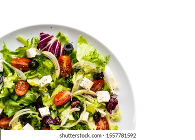 Fresh Greek Salad On A Plate On White Background