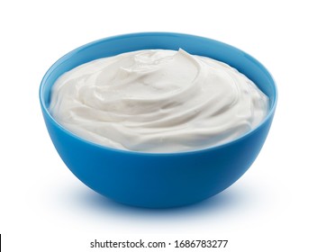 Fresh greek yogurt in blue bowl isolated on white background with clipping path