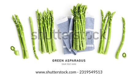 Fresh green asparagus isolated on white background. Creative layout. Healthy eating and dieting food concept. Design element and banner. Top view, flat lay
