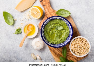 Fresh Green Basil Pesto With Italian Recipe Ingredients Over Light Table Copy Space For Text Overhead