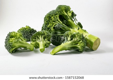 Similar – Small pieces of raw broccoli on white wood, Close up