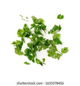 Fresh green chopped parsley leaves isolated on white background. Spicy aromatic sliced raw herbs of garden parsley. Cilantro or corriender leaves pieces top view