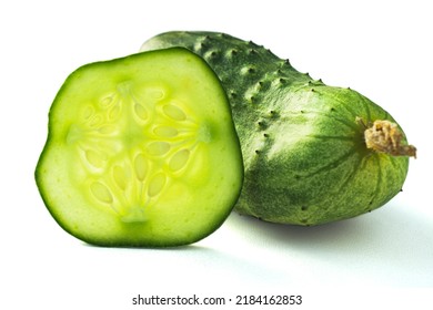 Fresh, green cucumber slice macro photo. Round slice of cucumber with seeds. Green pickle pulp isolated on white background