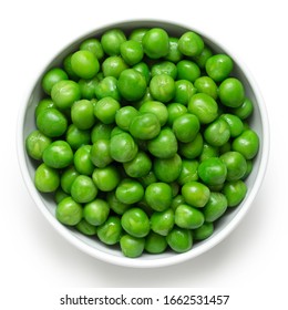 Fresh green garden peas in a white ceramic bowl isolated on white. Top view. - Shutterstock ID 1662531457