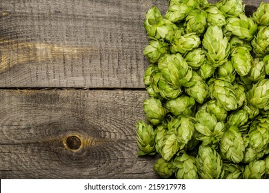 Fresh green hops on a wooden table