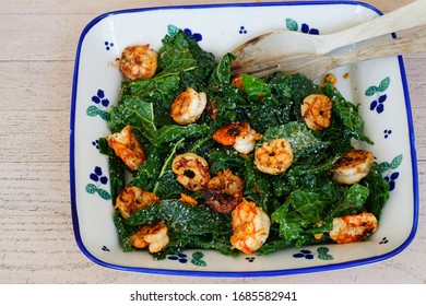 Fresh Green Kale Salad With Blackened Shrimp In A Bowl