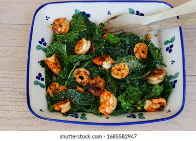 Fresh Green Kale Salad With Blackened Shrimp In A Bowl