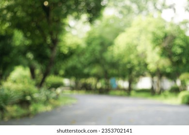 Fresh green lawns in the park. Blur nature bokeh green park trees in morning. - Powered by Shutterstock