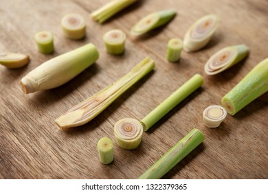 Fresh green lemongrass slices on wooden background.