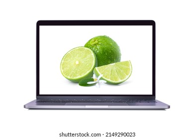 Fresh Green Lime Fruit On Laptop Computer Screen Isolated On White Background. (My Image)