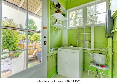 Fresh Green Mud Room With Windows And Sink.