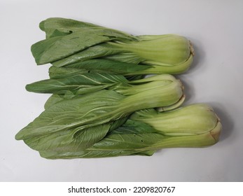 Fresh Green Mustard Greens (CaisimSawi Hijau) Are Isolated On White Background.