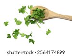 Fresh green parsley leaves pile in wooden spoon isolated on white background	