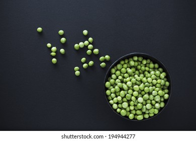 Fresh Green peas on black background