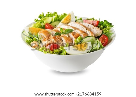 Fresh green salad with chicken breast and boiled egg isolated on white background