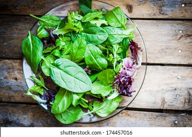 Fresh green salad with spinach,arugula,romaine and lettuce - Powered by Shutterstock