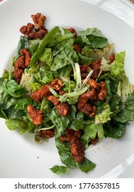 Fresh Green Salad Tossed With Spicy Walnuts In A Vinaigrette.