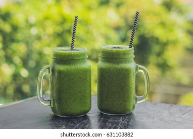 Fresh green smoothie with banana and spinach with heart of sesame seeds. Love for a healthy raw food concept. - Powered by Shutterstock