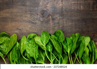 Fresh Green Spinach On Vintage Wooden Texture,top View