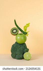 Fresh Green Vegetables And Fruits Balancing On The Table. Equilibrium Floating Food Balance