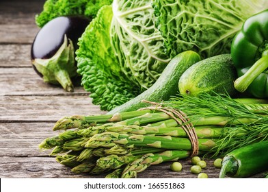 Fresh Green Vegetables On Wooden Table 