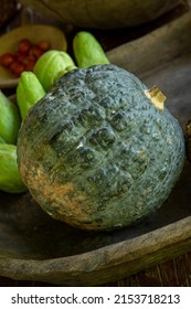 Fresh Green Whole Kabocha Pumpkin On Wooden Bowl