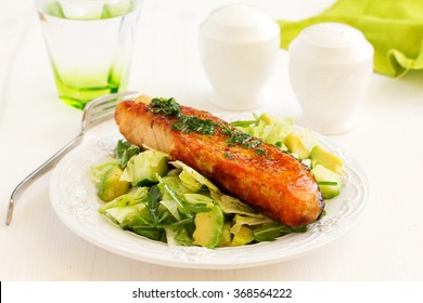 Fresh Grilled Salmon With A Salad Of Avocado.