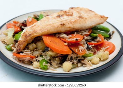 Fresh Grilled Tilapia On Top Of A Vegetable Stirfry