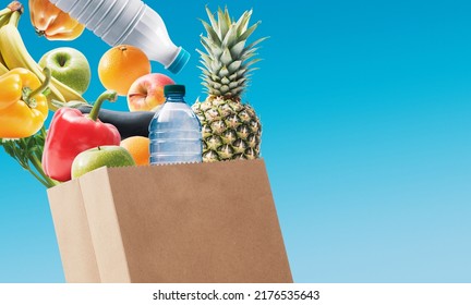 Fresh Groceries And Bottles Falling Into A Bag, Grocery Shopping Concept